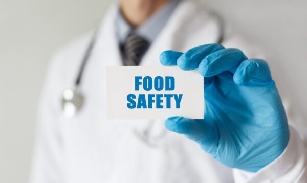 Doctor,Holding,A,Card,With,Text,Food,Safety,,Medical,Concept