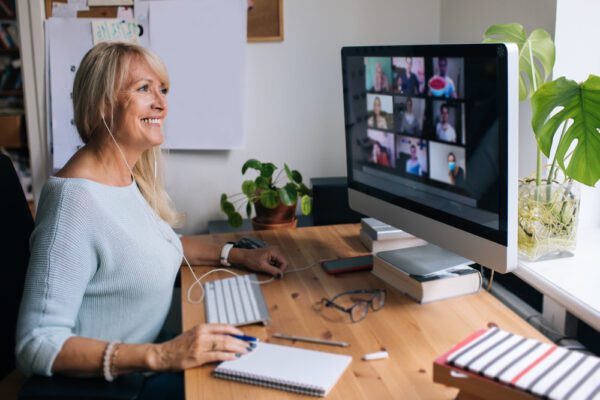 Smiling,Mature,Woman,Having,Video,Call,Via,Computer,In,The