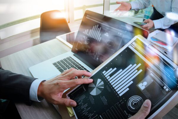 Businessman,Making,Presentation,With,His,Colleagues,And,Business,Tablet,Digital